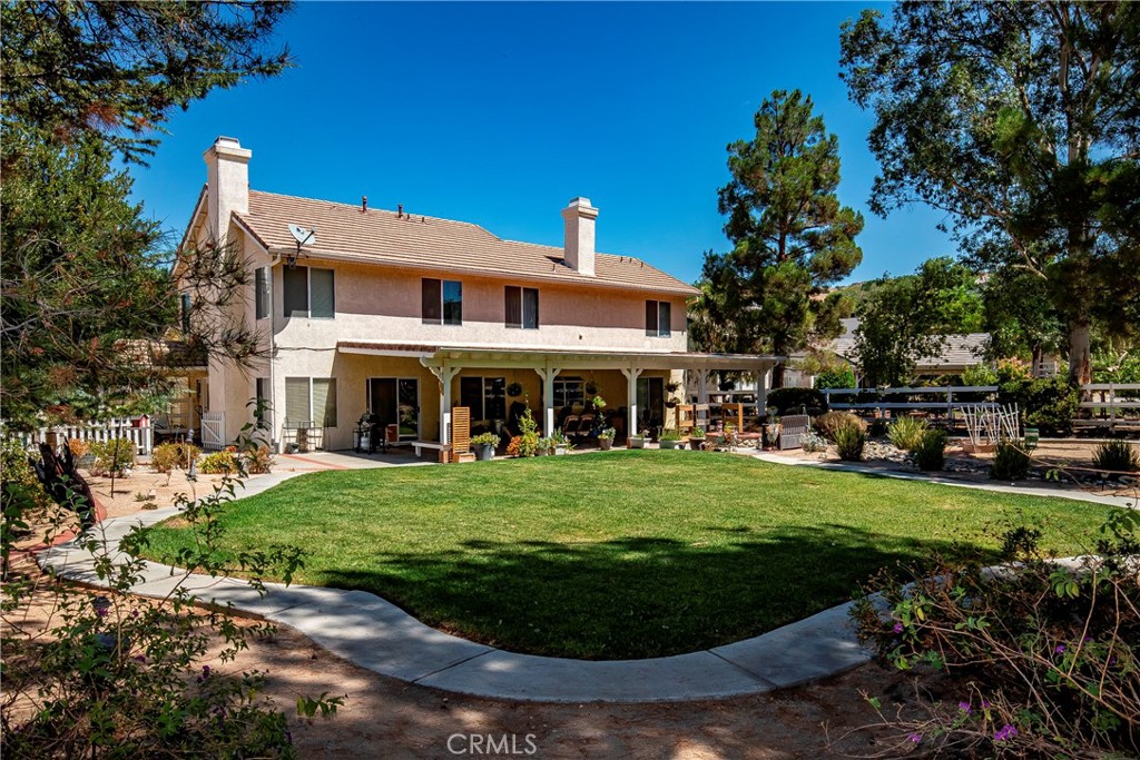 32201 Joaquin Road Acton, CA 93510 - Photo 55 of 75 a view of a big house with a big yard and potted plants