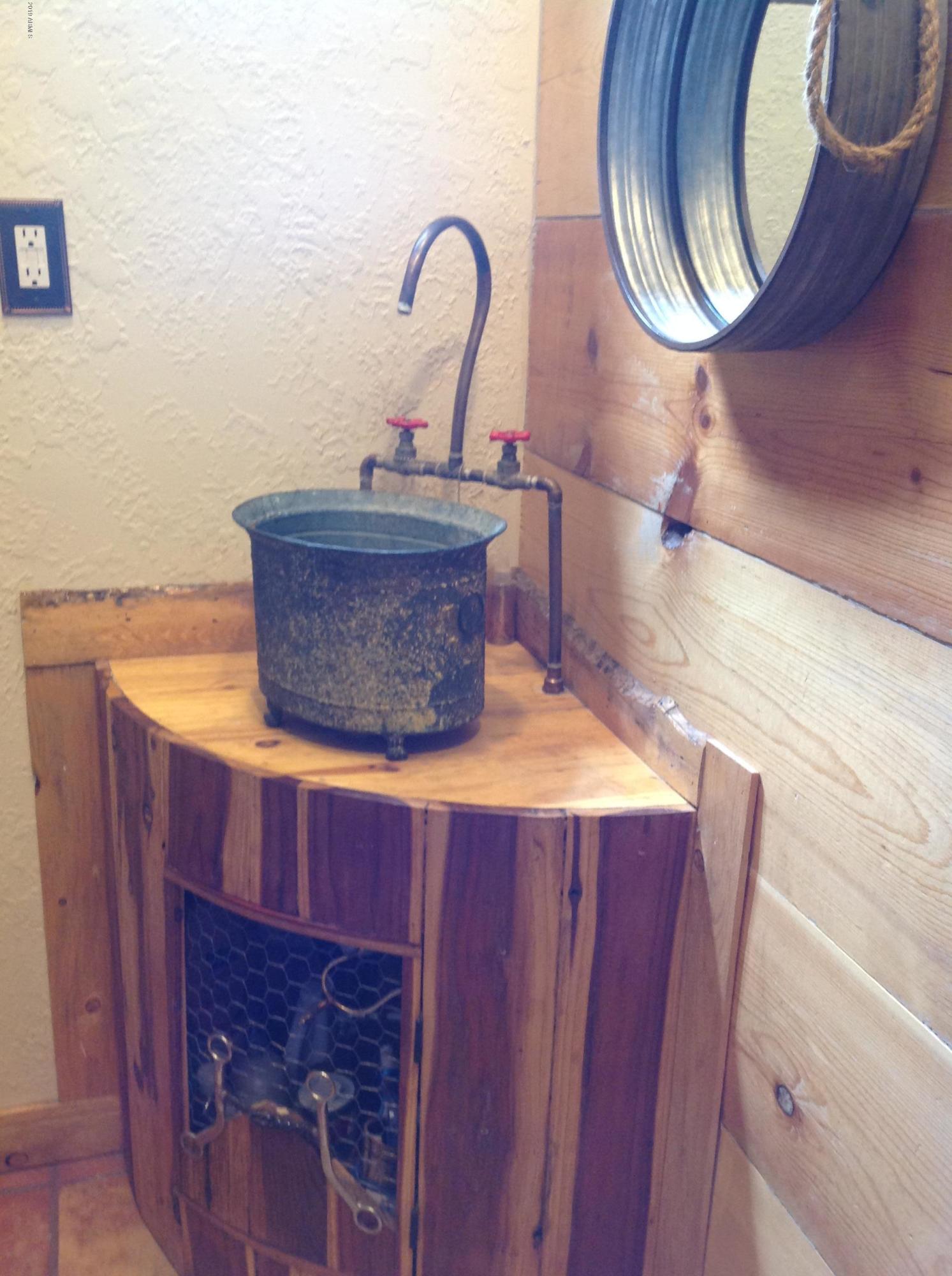 7342 North College Peak Road Douglas, AZ 85607 - Photo 20 of 71 half barrel vanity in hall bah