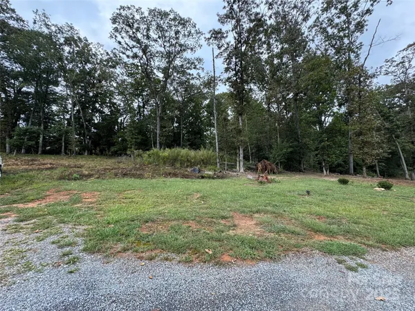a view of outdoor space with trees all around