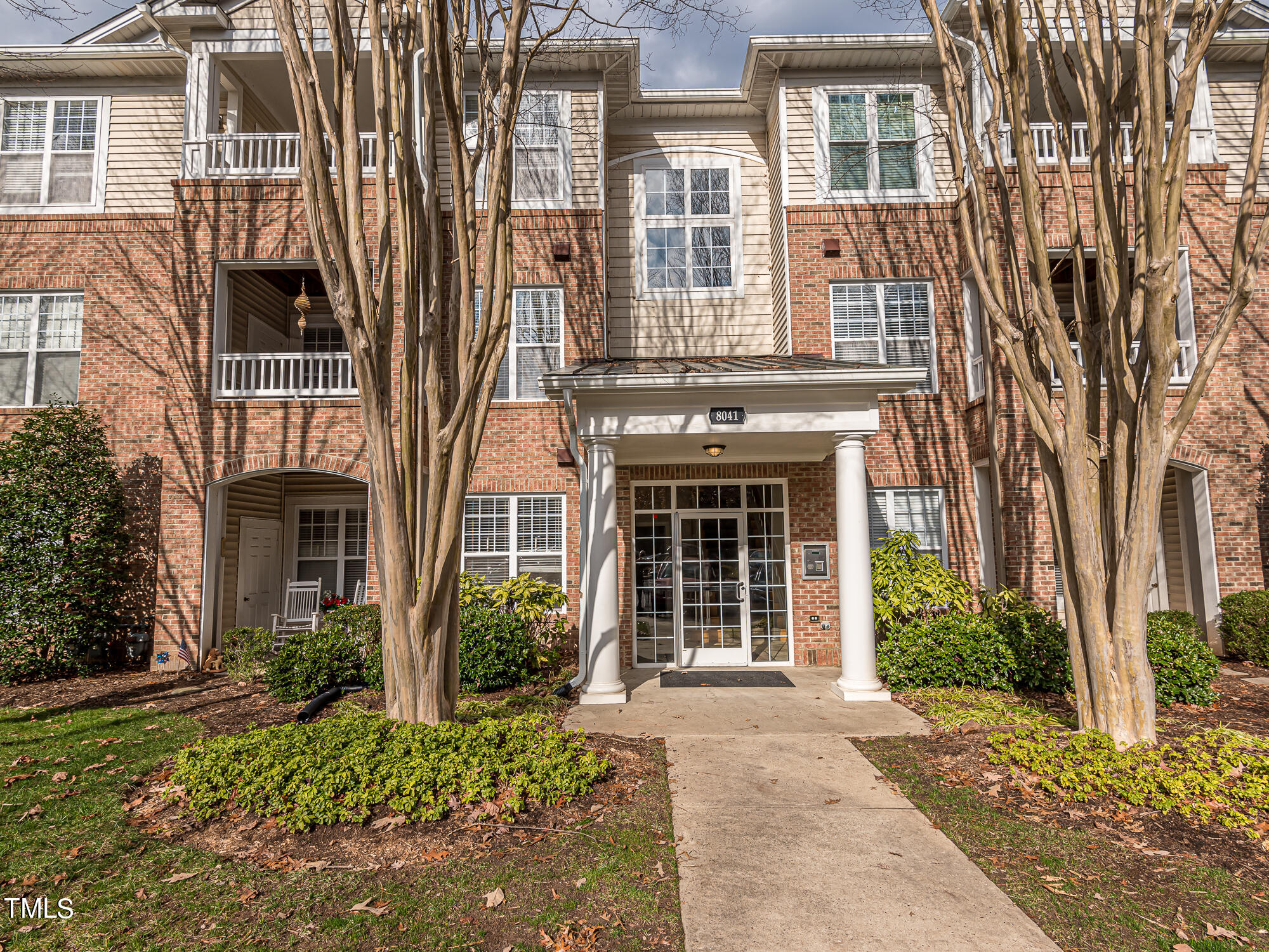 8041 Allyns Landing Way, Unit 103 Raleigh, NC 27615 - Photo 1 of 33 front view of a brick house with a large windows