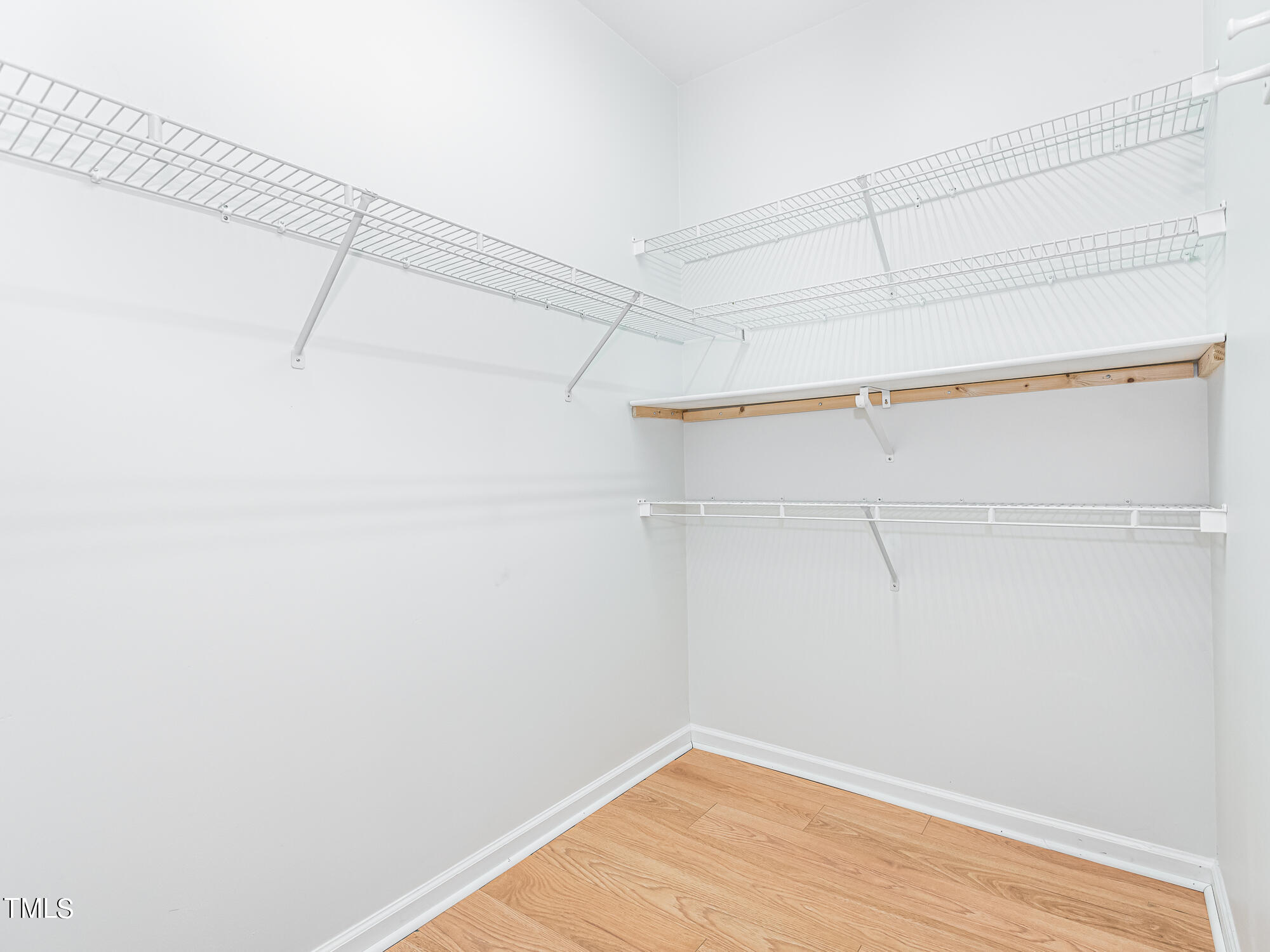 8041 Allyns Landing Way, Unit 103 Raleigh, NC 27615 - Photo 12 of 33 a view of a room with racks on the wall