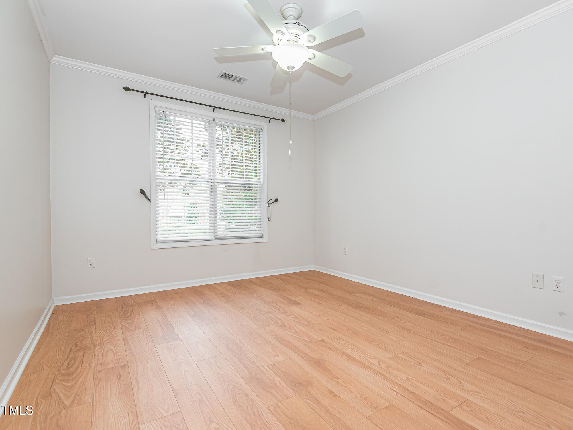 8041 Allyns Landing Way, Unit 103 Raleigh, NC 27615 - Photo 13 of 33 wooden floor in an empty room with a window
