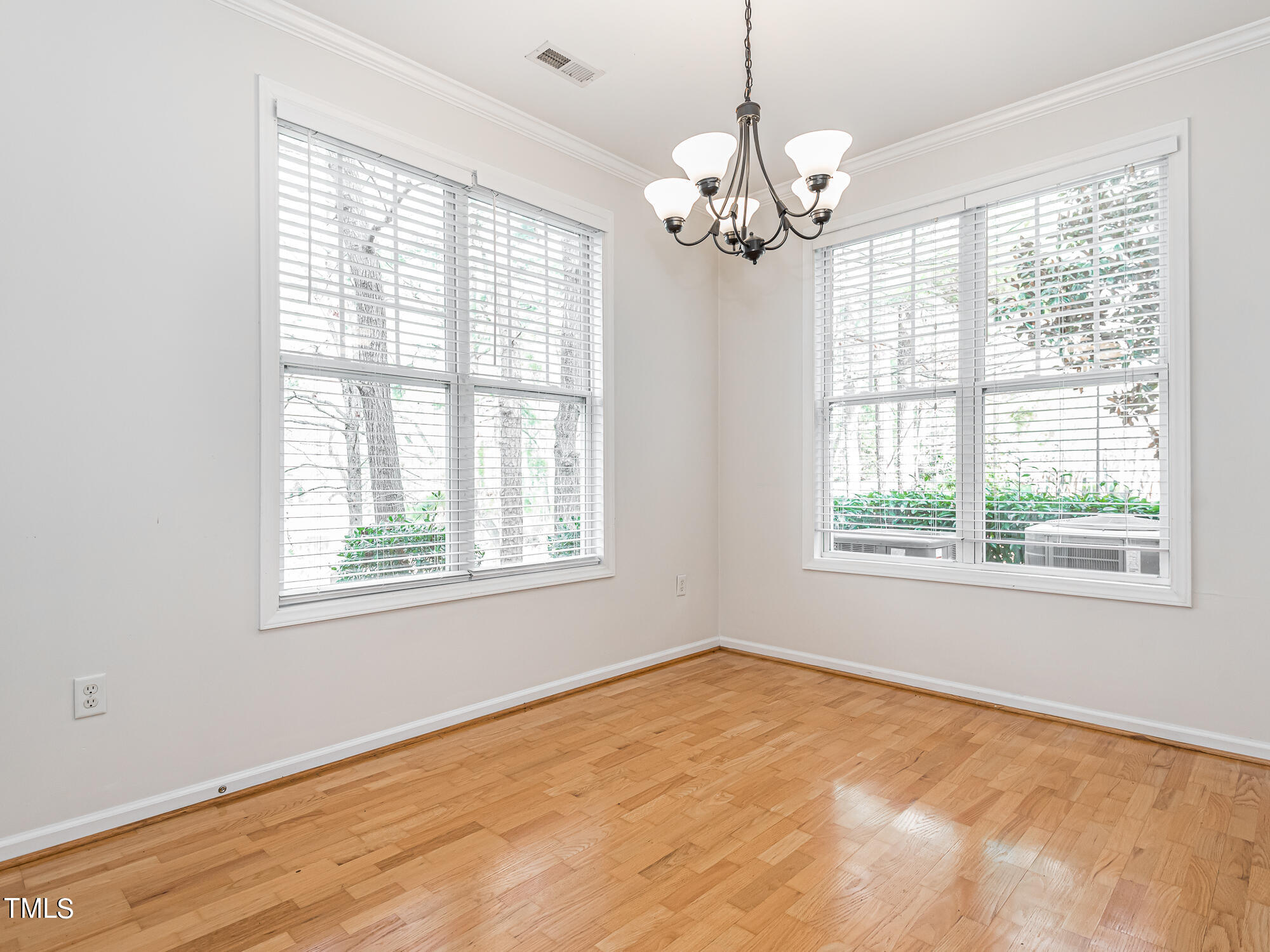 8041 Allyns Landing Way, Unit 103 Raleigh, NC 27615 - Photo 18 of 33 a view of an empty room with a window