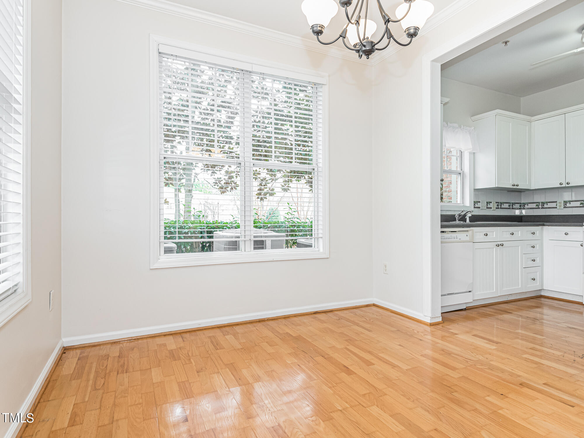 8041 Allyns Landing Way, Unit 103 Raleigh, NC 27615 - Photo 22 of 33 a view of a kitchen with a sink cabinets and a window