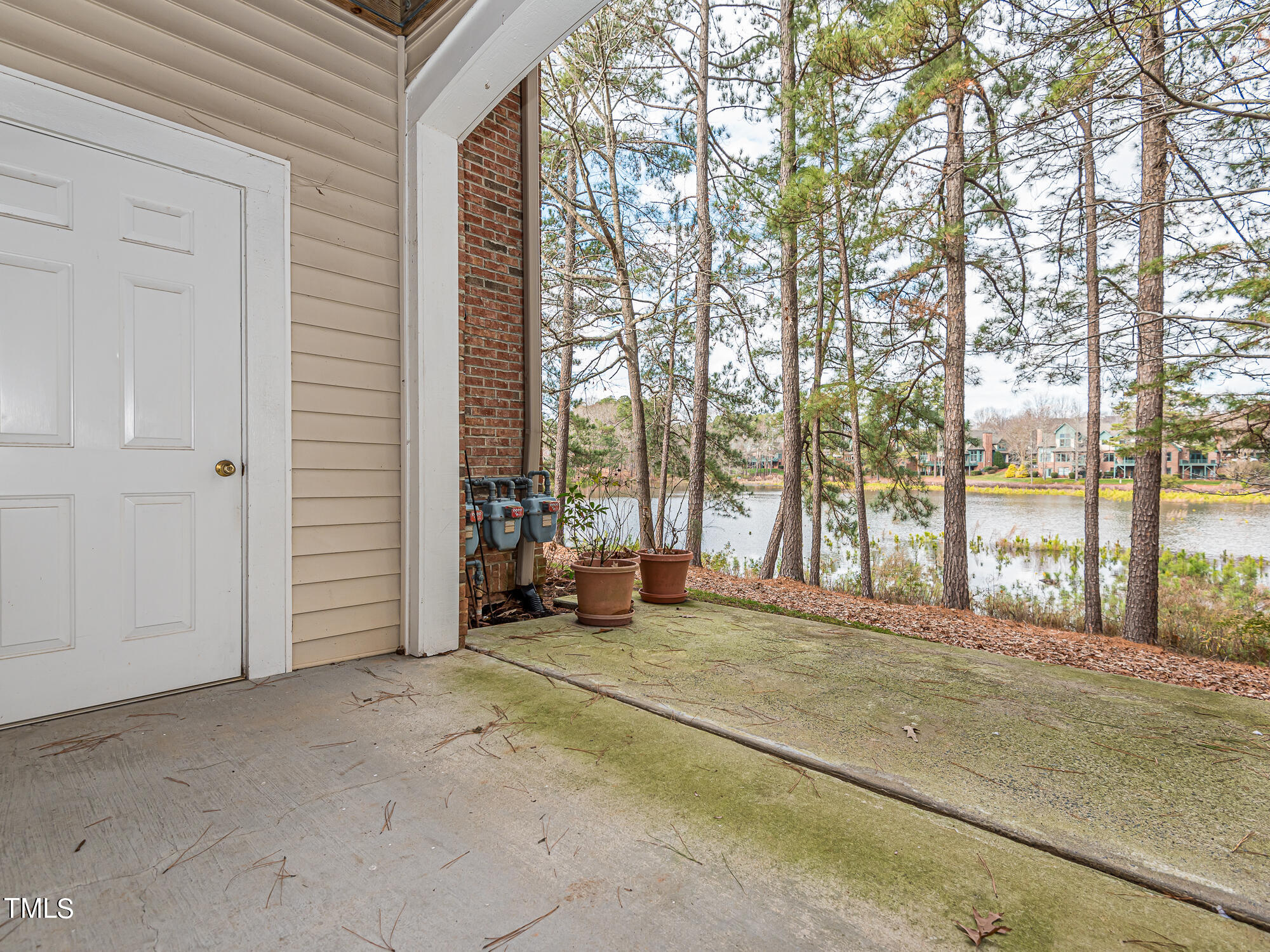 8041 Allyns Landing Way, Unit 103 Raleigh, NC 27615 - Photo 23 of 33 a view of a house with a outdoor space