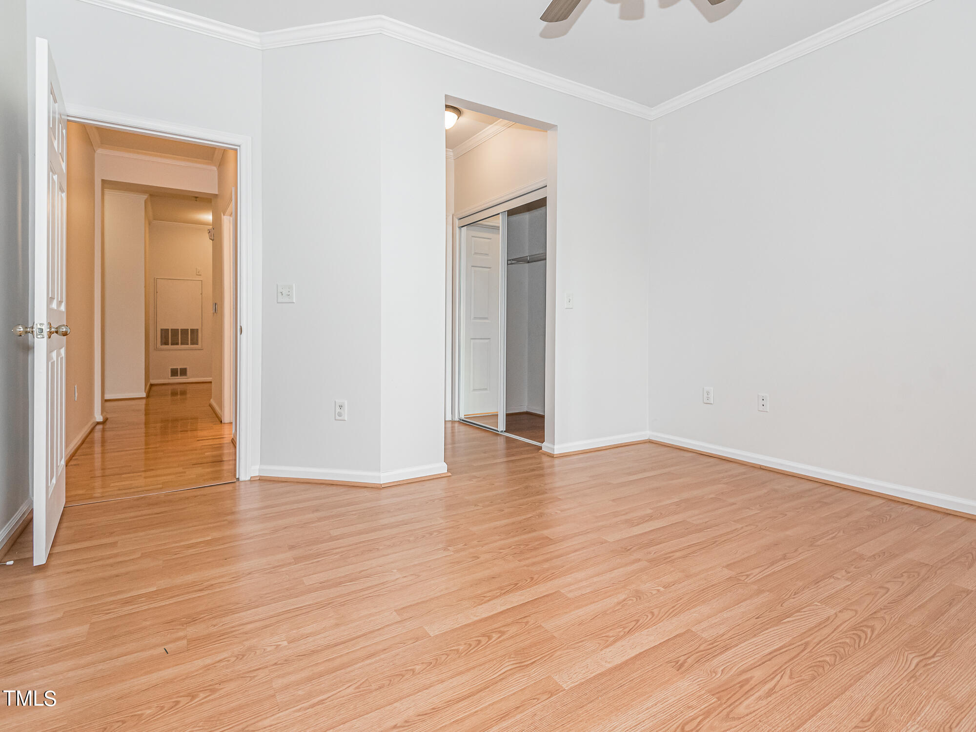 8041 Allyns Landing Way, Unit 103 Raleigh, NC 27615 - Photo 6 of 33 a view of empty room with wooden floor