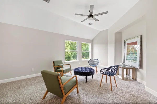 a living room with furniture and a window