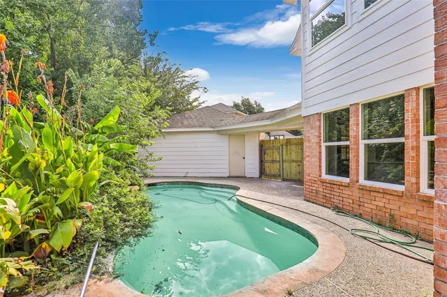 front view of a house with a garden