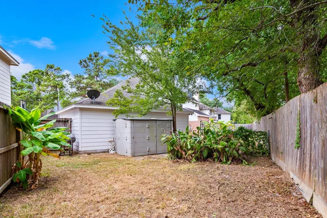 a house that has a tree in front of it