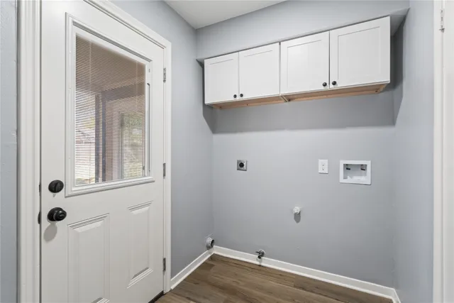 a kitchen with granite countertop a refrigerator sink and microwave