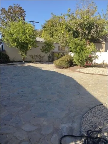 a view of a yard with an outdoor space