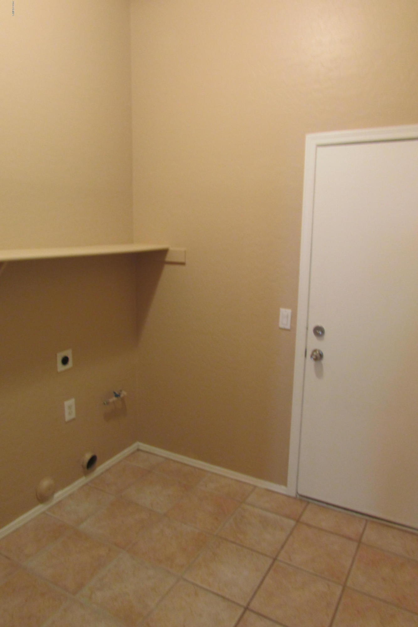 716 East Ranch Road Gilbert, AZ 85296 - Photo 13 of 22 an empty room with a door