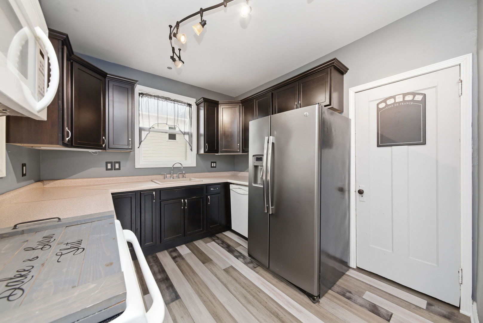 500 Catherine Street Ottawa, IL 61350 - Photo 8 of 23 a kitchen with stainless steel appliances granite countertop a refrigerator and a sink