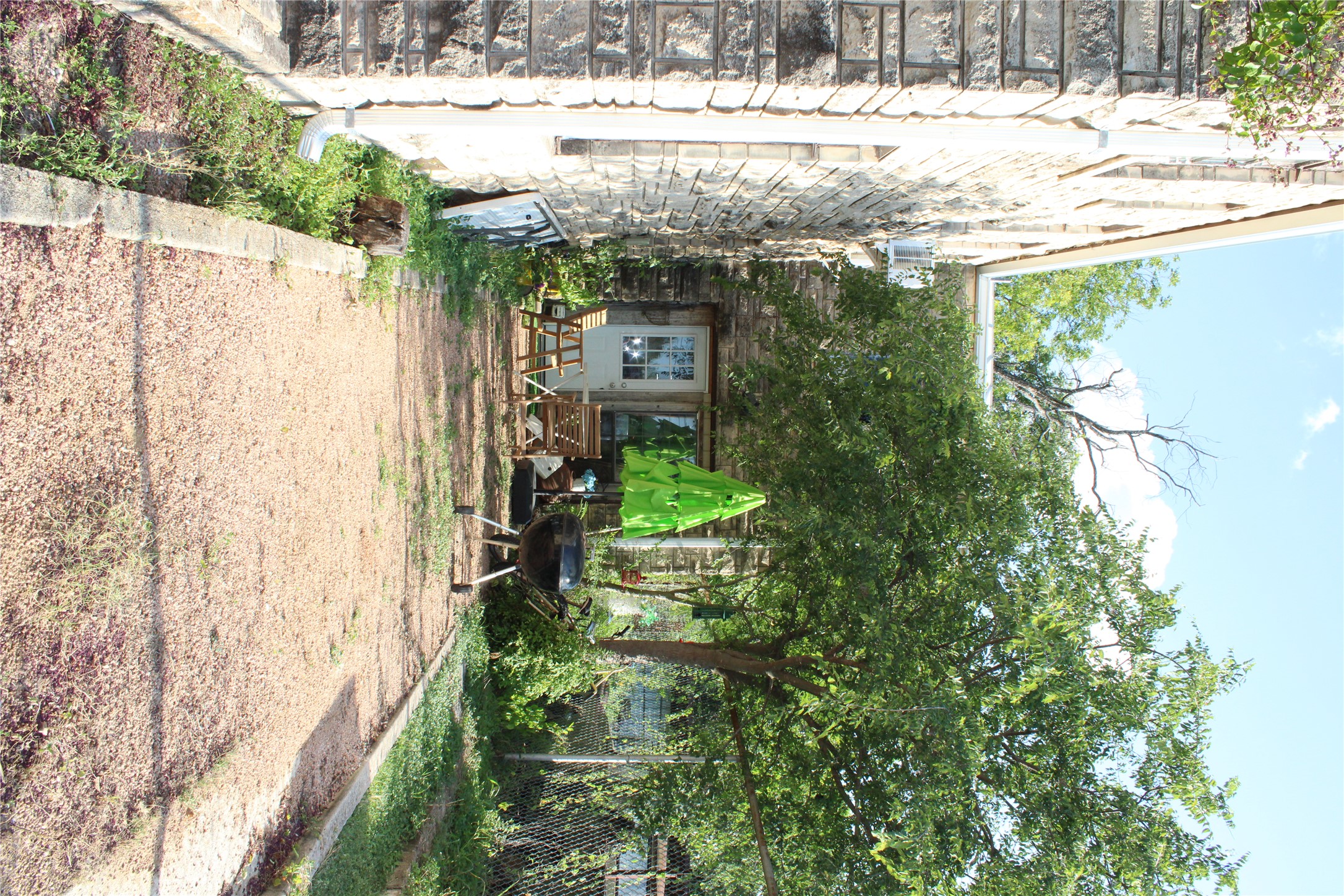 615 Pecan Street Junction, TX 76849 - Photo 5 of 14 a view of house with backyard and sitting area