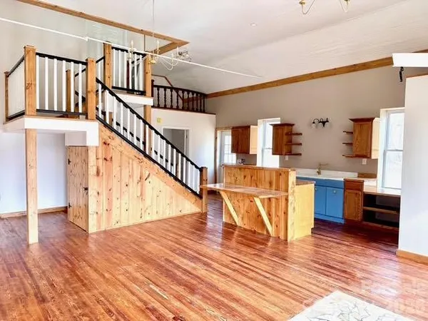 a kitchen with a sink and a stove top oven