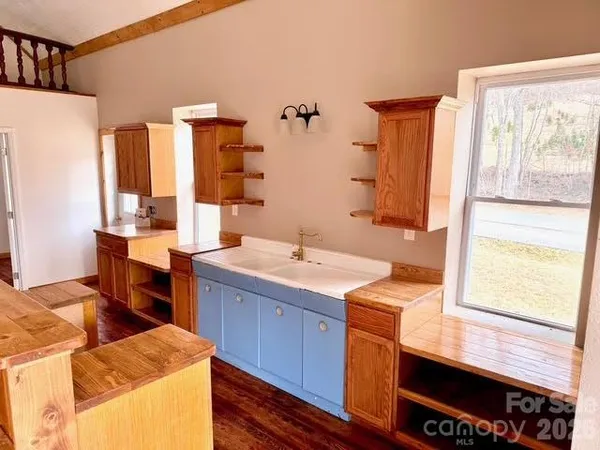 a large bathroom with a double vanity sink and a mirror