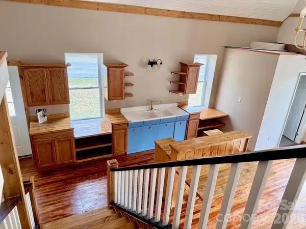 a view of an entryway with wooden floor
