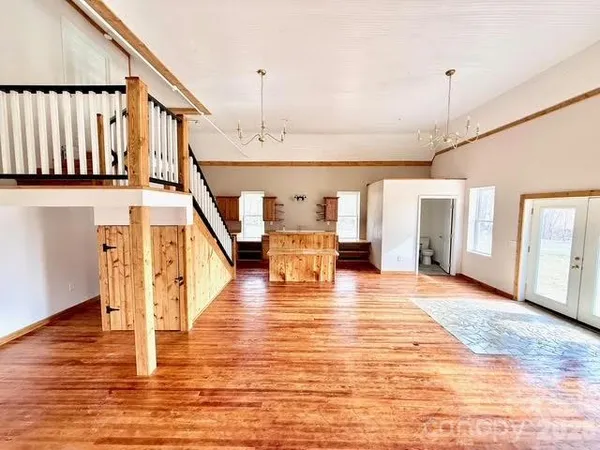 a bathroom with a shower a toilet and a sink