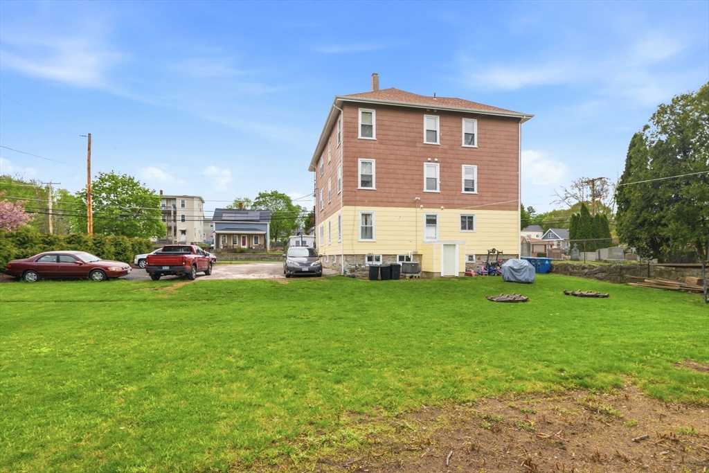 612 Rathbun Street Blackstone, MA 01504 - Photo 12 of 41 a front view of a house with a yard