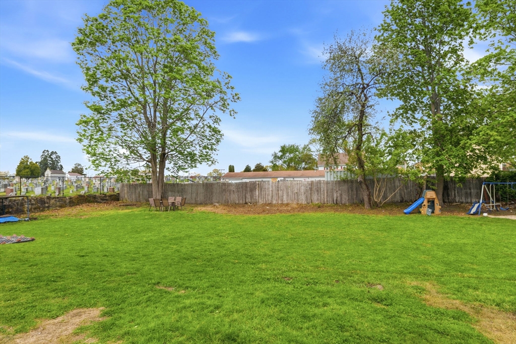 612 Rathbun Street Blackstone, MA 01504 - Photo 13 of 41 a view of a backyard with a slide