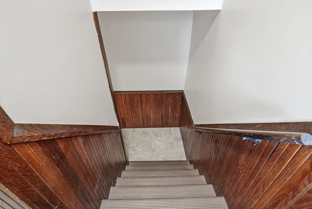 612 Rathbun Street Blackstone, MA 01504 - Photo 29 of 41 a view of wooden floor with staircase