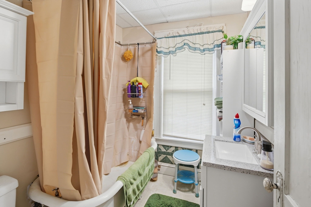 612 Rathbun Street Blackstone, MA 01504 - Photo 35 of 41 a bathroom with a sink and a mirror