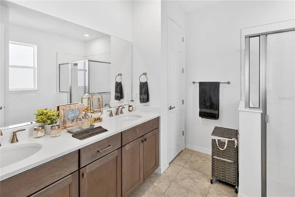 a bathroom with a sink a light fixture and a mirror