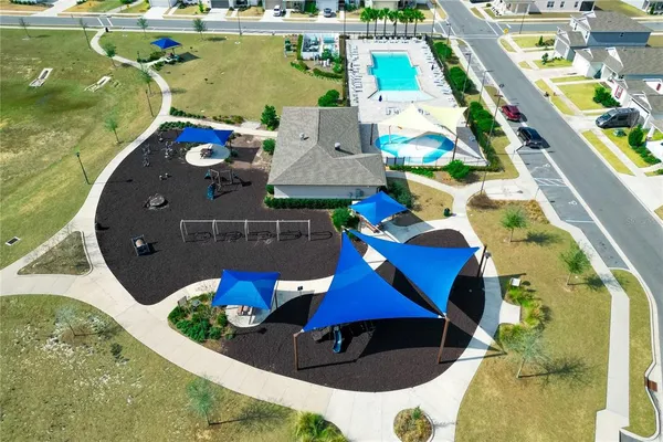 an aerial view of a house with a swimming pool