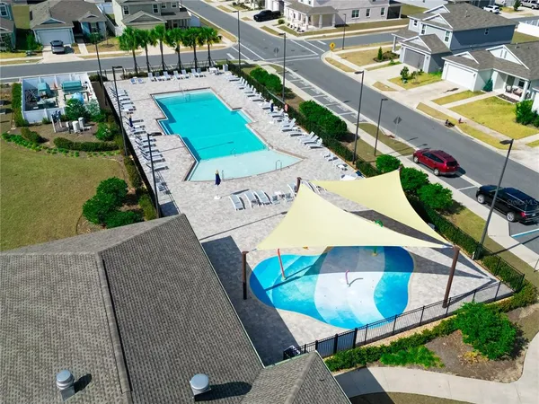 a view of swimming pool with outdoor seating