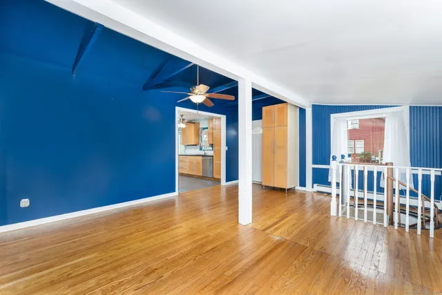 a view of livingroom with hardwood and furniture
