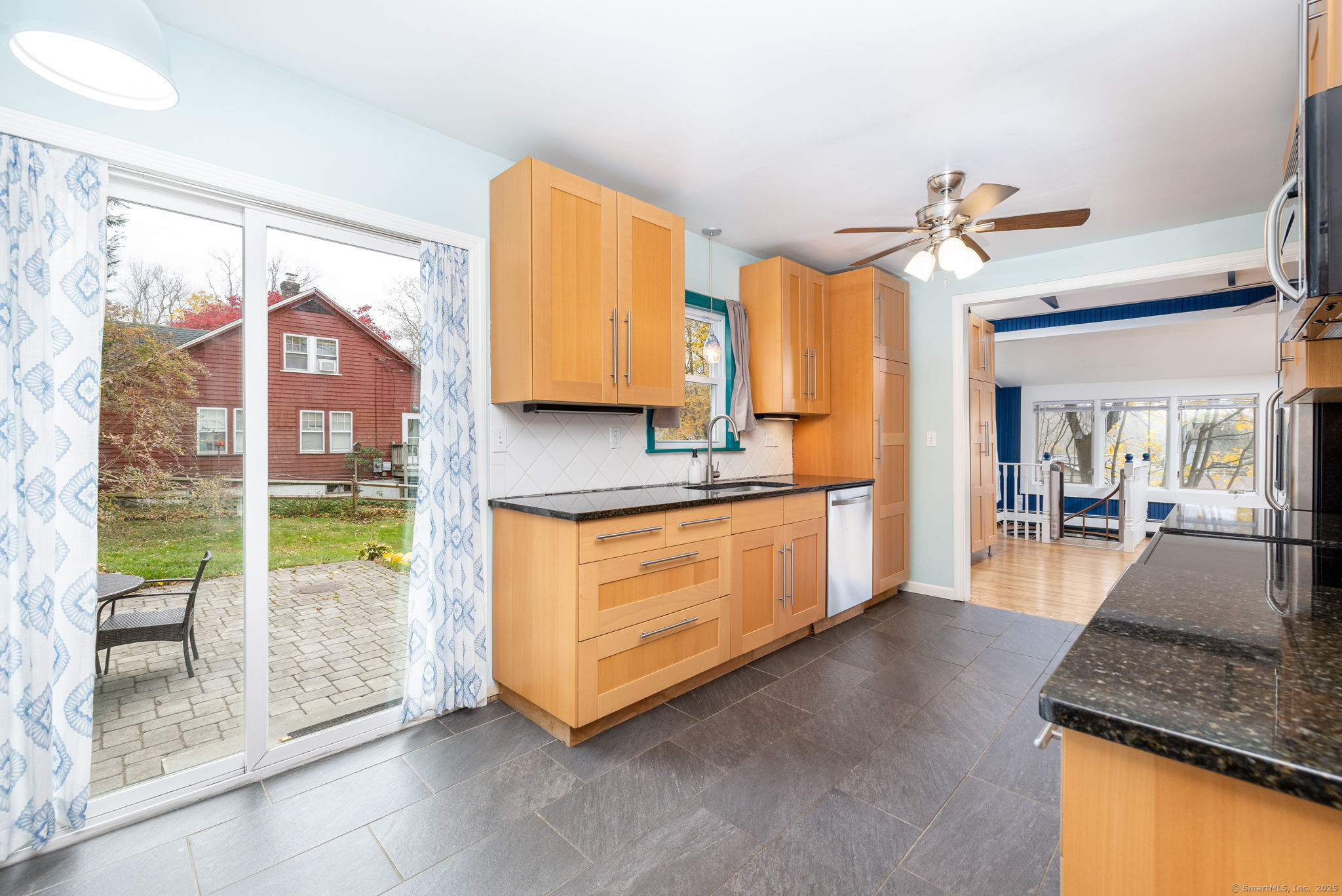 30 Lakeview Drive Bethlehem, CT 06751 - Photo 12 of 27 a kitchen with kitchen island granite countertop a stove a sink and a refrigerator