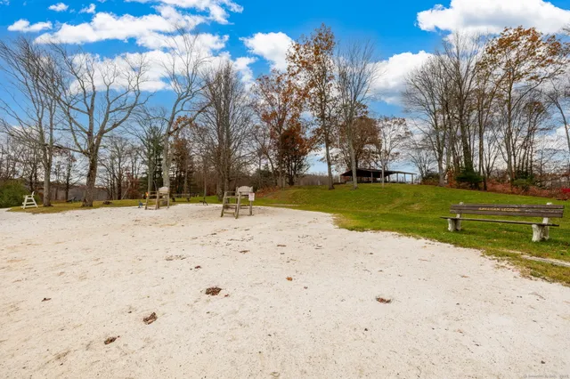 a view of a playground with basketball court