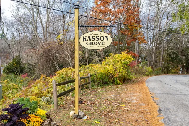 a view of sign board with buildings