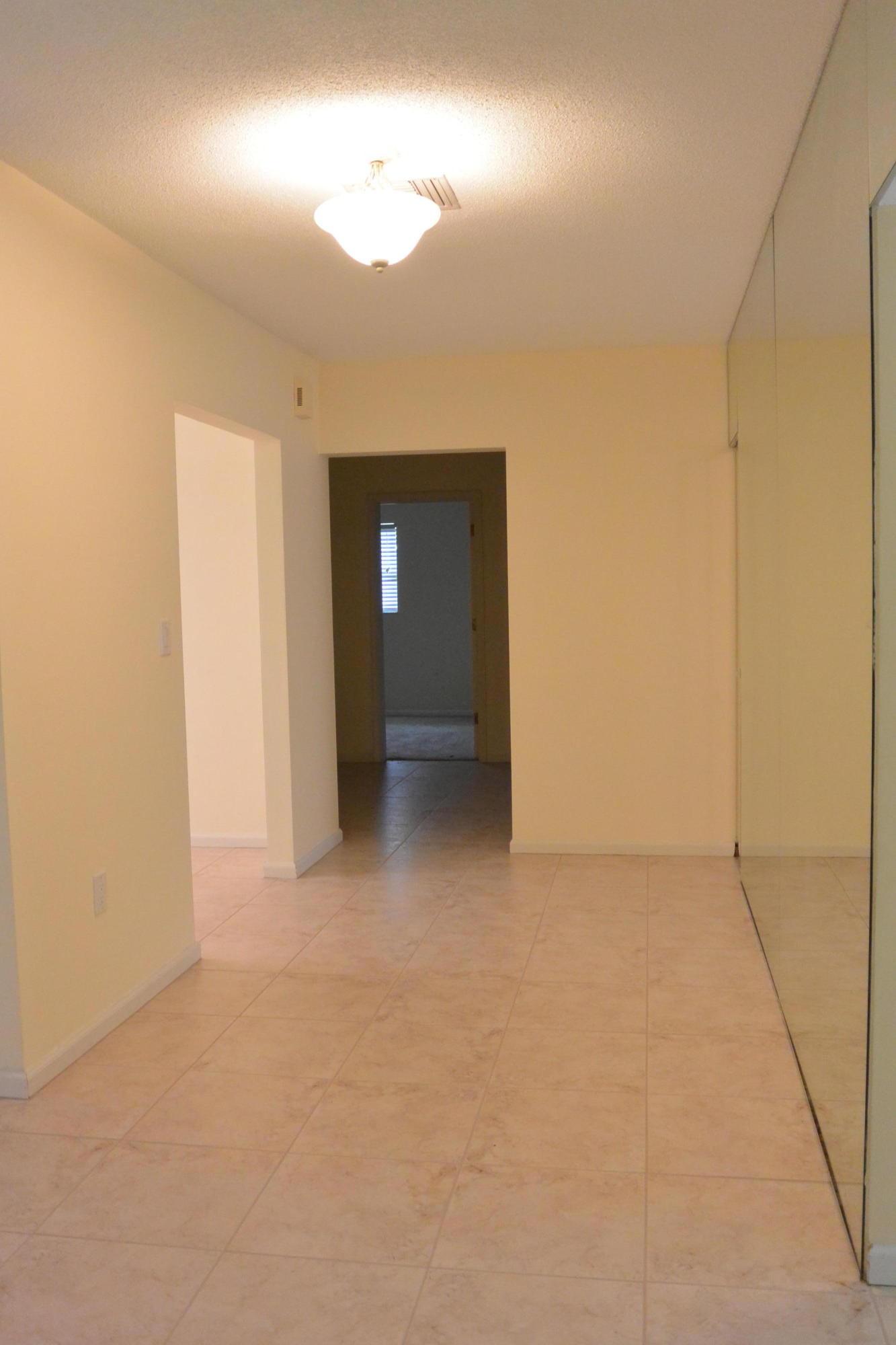 6100 Northwest 4th Avenue Boca Raton, FL 33487 - Photo 9 of 17 Hallway with mirrored wall