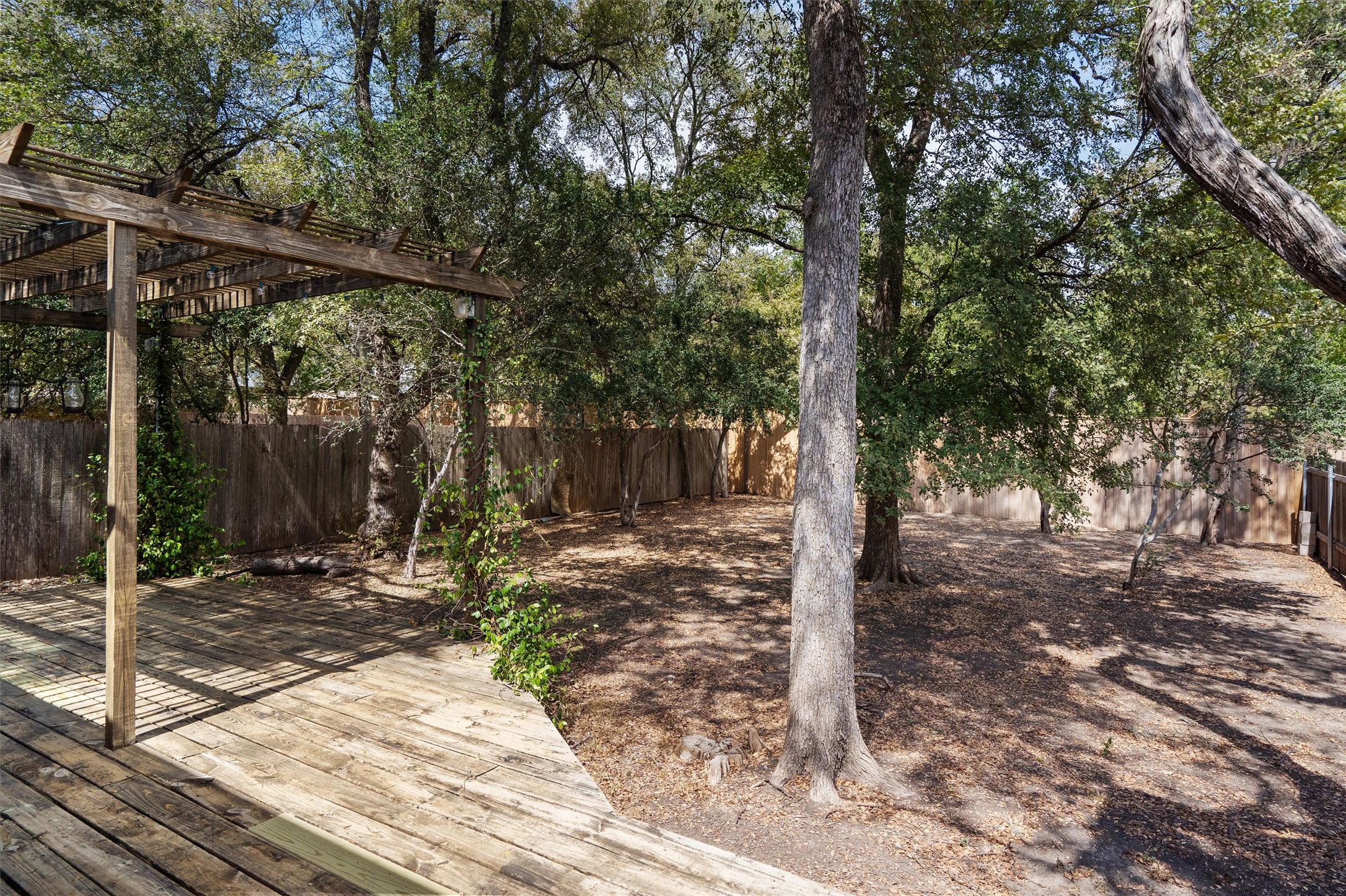 7709 Menchaca Road, Unit 22 Austin, TX 78745 - Photo 31 of 35 a view of a house with backyard