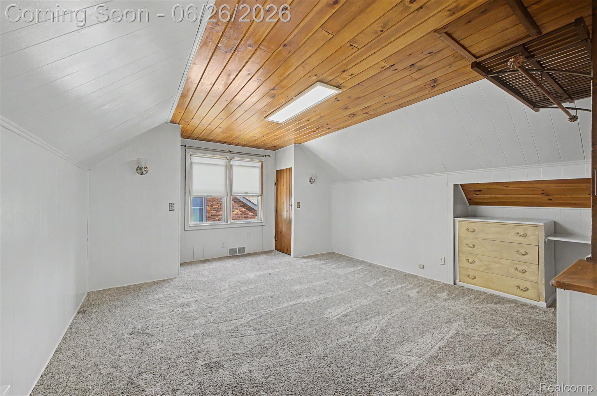 2216 Banner Street Dearborn, MI 48124 - Photo 20 of 34 Attic room featuring a wood-finish plank ceiling with a rectangular flush-mount light fixture
