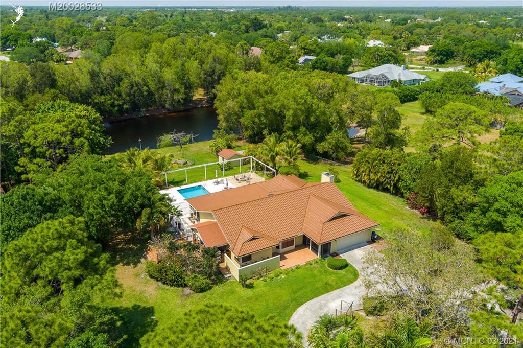 2850 Southwest Murphy Road Palm City, FL 34990 - Photo 3 of 27 an aerial view of a house with a yard