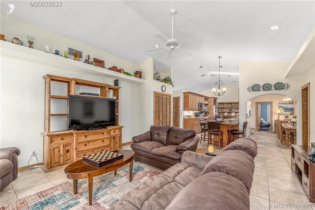 2850 Southwest Murphy Road Palm City, FL 34990 - Photo 7 of 27 a living room with furniture and a flat screen tv