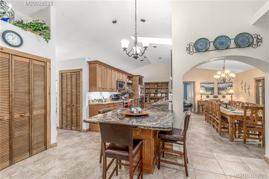 2850 Southwest Murphy Road Palm City, FL 34990 - Photo 8 of 27 a very nice looking dining room with a table and chairs