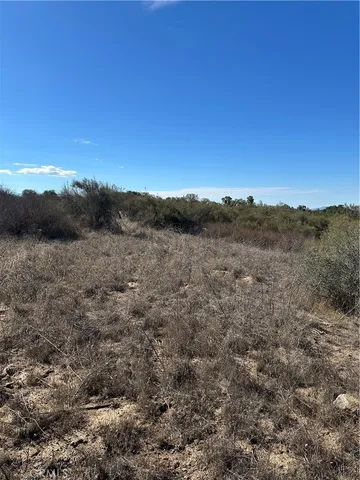 a view of mountain with sunset