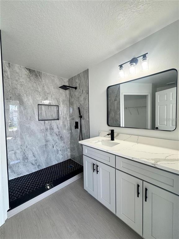 207 High Ridge Drive Davenport, FL 33837 - Photo 18 of 33 a bathroom with a double vanity sink and mirror