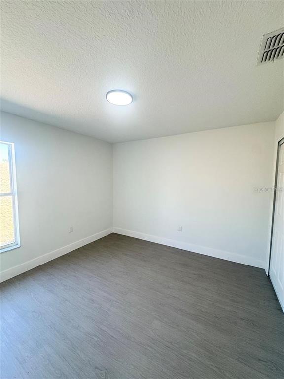 207 High Ridge Drive Davenport, FL 33837 - Photo 21 of 33 an empty room with a window