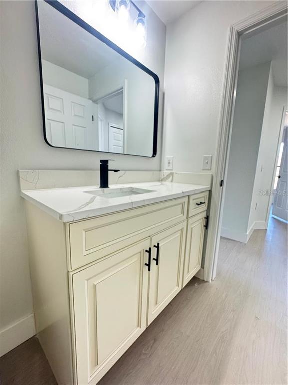 207 High Ridge Drive Davenport, FL 33837 - Photo 25 of 33 a bathroom with a sink and a mirror