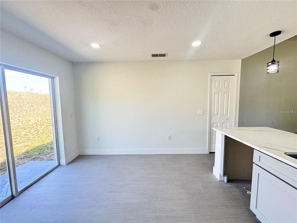 207 High Ridge Drive Davenport, FL 33837 - Photo 9 of 33 a view of an empty room with a window