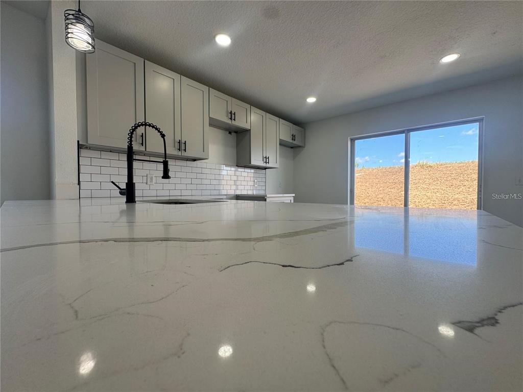 207 High Ridge Drive Davenport, FL 33837 - Photo 10 of 33 a large bathroom with a large tub and shower