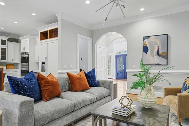a view of a dining room with furniture wooden floor and chandelier