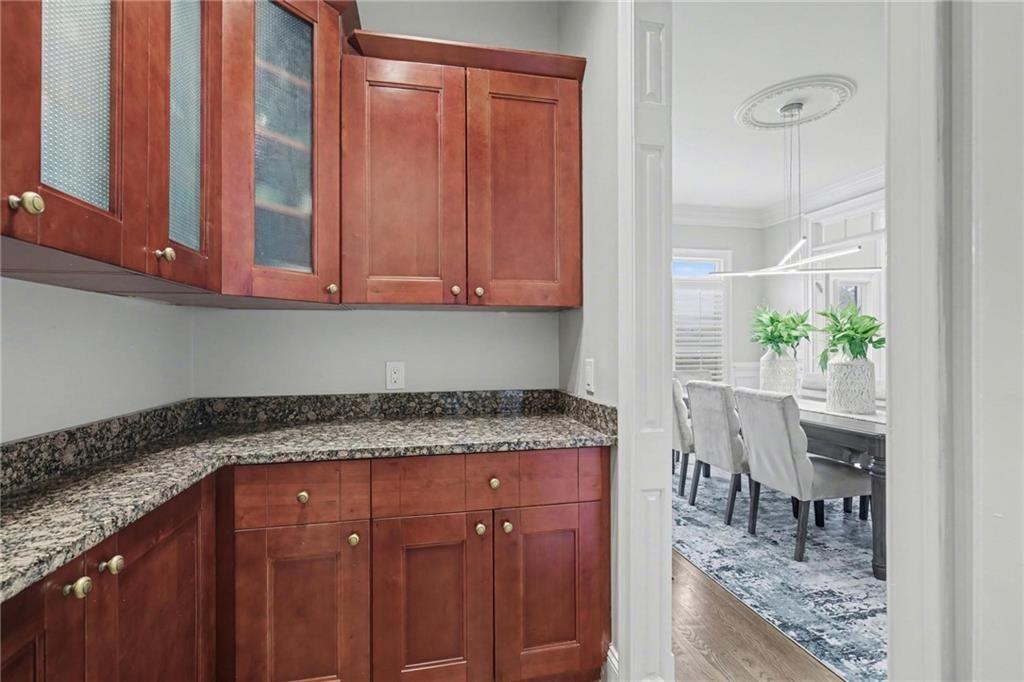 225 Farmbrooke Court Atlanta, GA 30350 - Photo 31 of 84 a kitchen with granite countertop a sink and cabinets