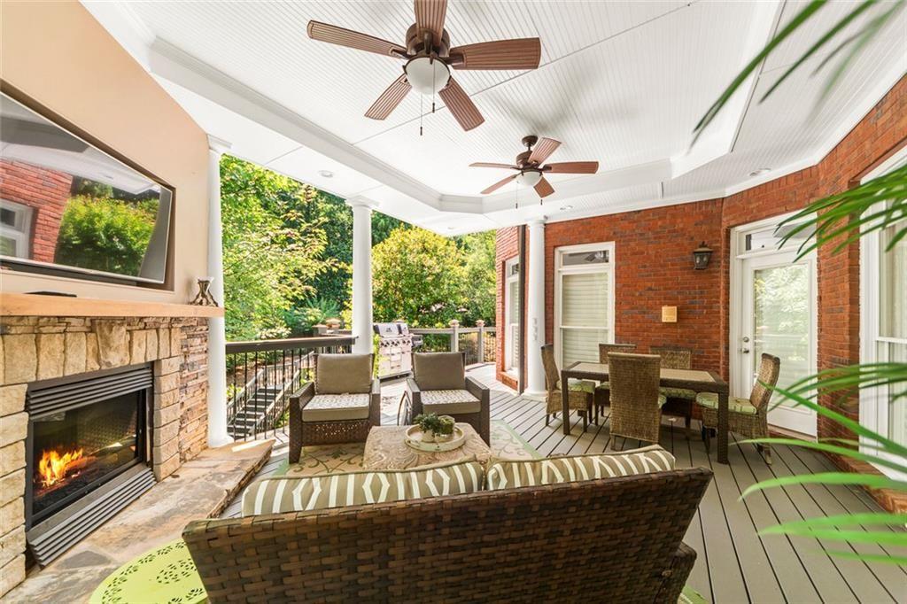 225 Farmbrooke Court Atlanta, GA 30350 - Photo 38 of 84 a living room with furniture fireplace and a large window