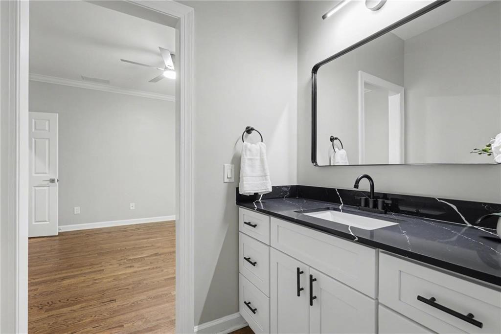 225 Farmbrooke Court Atlanta, GA 30350 - Photo 61 of 84 a bathroom with a granite countertop sink and a mirror