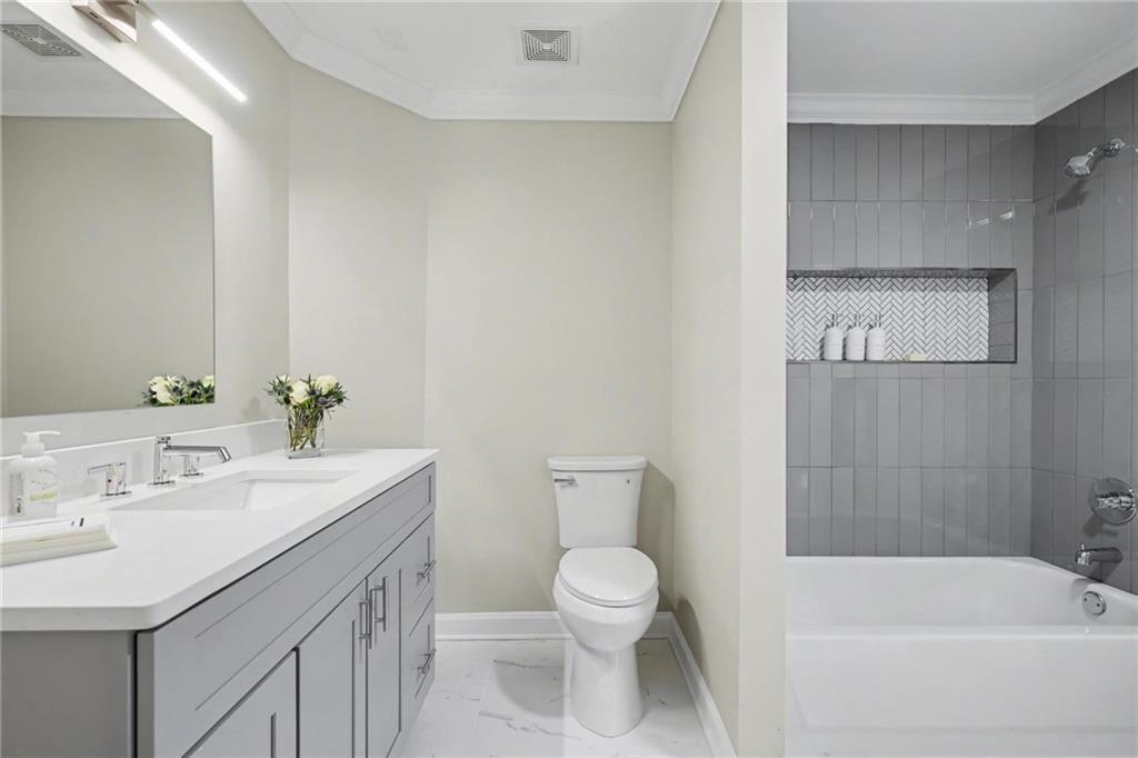 225 Farmbrooke Court Atlanta, GA 30350 - Photo 68 of 84 a bathroom with a sink a toilet and shower